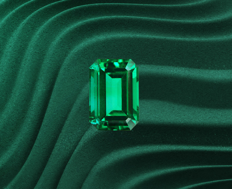 Fabrication joaillerie sur-mesure avec émeraude certifiée en atelier.